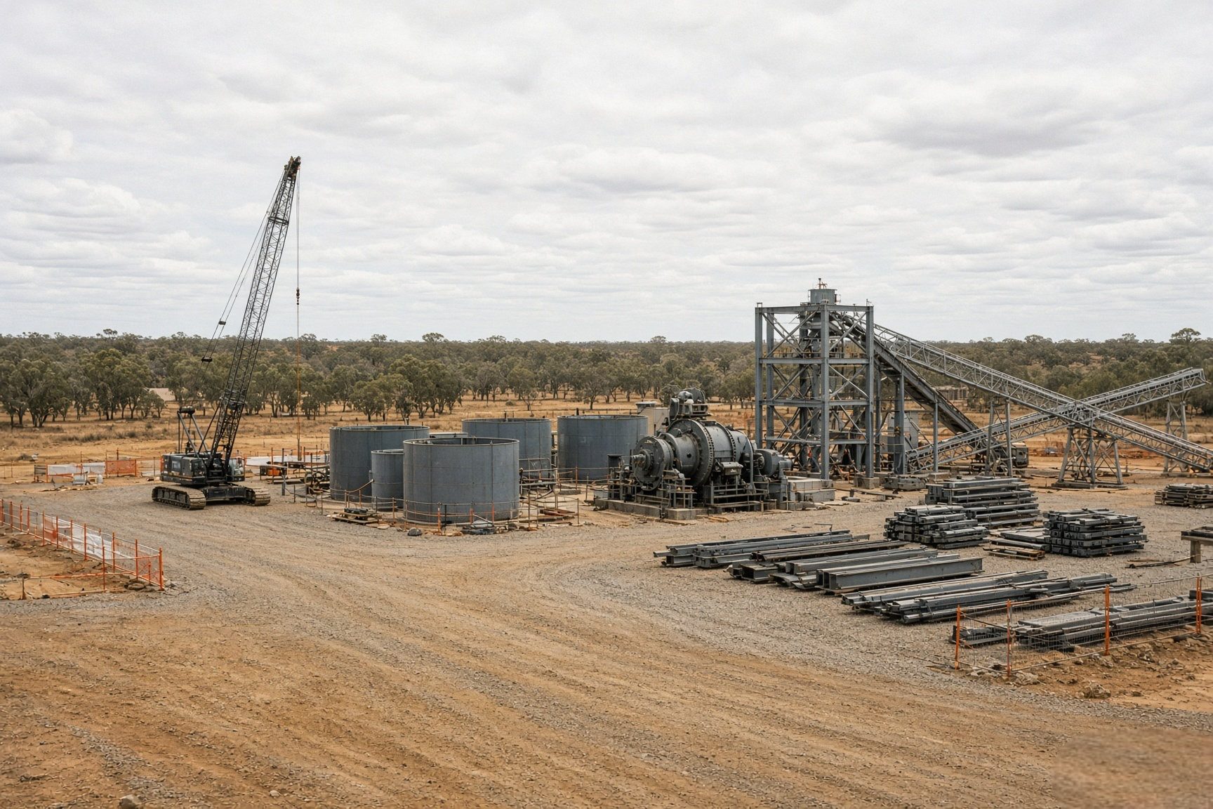 Leach tanks, mill and structural steelwork under construction on a levelled processing plant pad